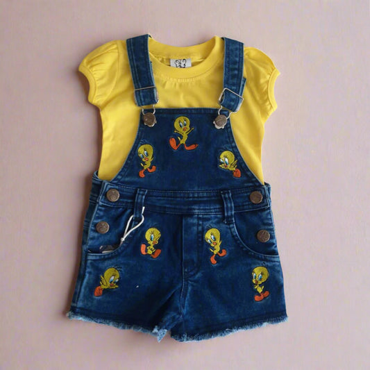 Yellow shirt with blue denim overalls featuring cartoon characters on a white background